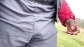 Muscular black hunk shows off huge sweatpants bulge outdoors