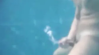 Straight twink jerks his big cock underwater and cums