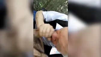 Older man sucks younger cock outdoors