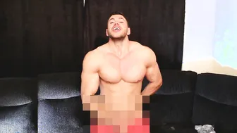Muscular hunk strokes his hard cock in solo jerk-off