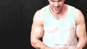 Muscular oiled stud strokes his hard cock solo