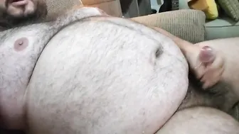 Hairy bear pissing and jerking off on couch