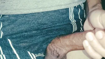 Oiled twink strokes his thick uncut cock in solo masturbation