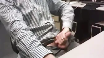 Mature guy jerks his big cock at the office